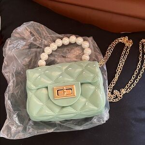 Mint Green Quilted Handbag with Pearl Handle. Gold chain for Crossbody.
